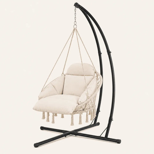 Beige hanging chair with black stand on a light beige background