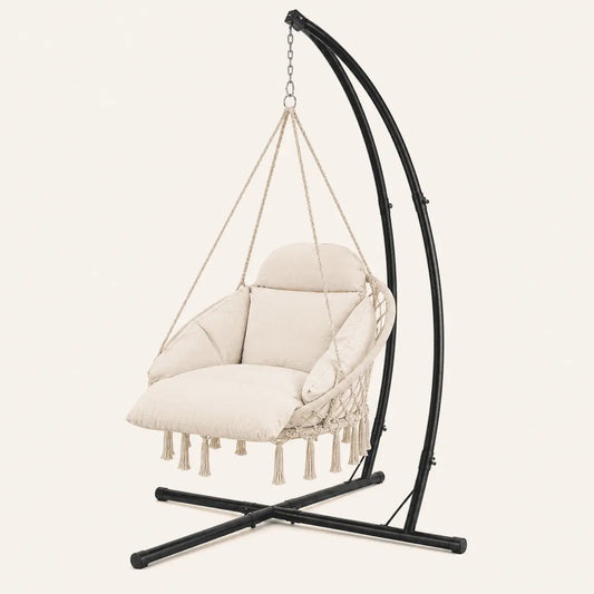 Beige hanging chair with black stand on a light beige background